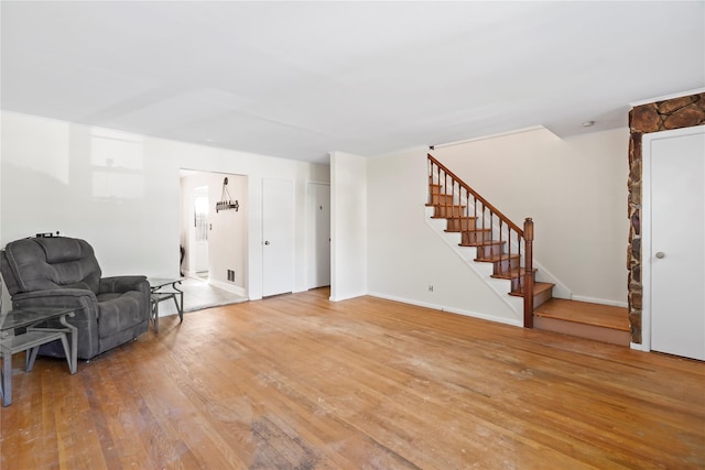 31 Westwood Ave, New Rochelle, NY 10801 - sitting room featuring stairway, light wood-style flooring, and baseboards