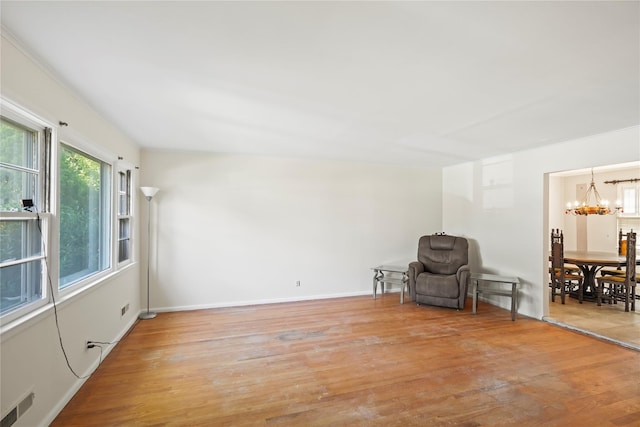 31 Westwood Ave, New Rochelle, NY 10801 - unfurnished room with a chandelier, wood finished floors, and baseboards