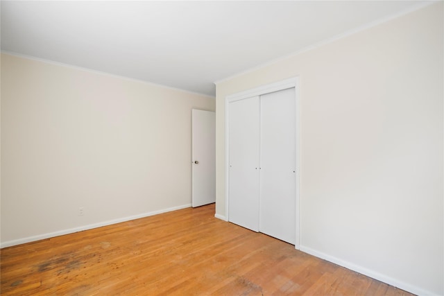 31 Westwood Ave, New Rochelle, NY 10801 - unfurnished bedroom featuring ornamental molding, light wood-style floors, a closet, and baseboards