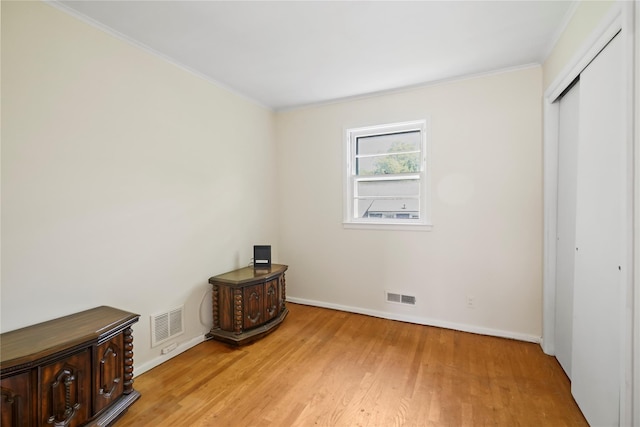 31 Westwood Ave, New Rochelle, NY 10801 - unfurnished bedroom featuring light wood-type flooring, ornamental molding, baseboards, and a closet