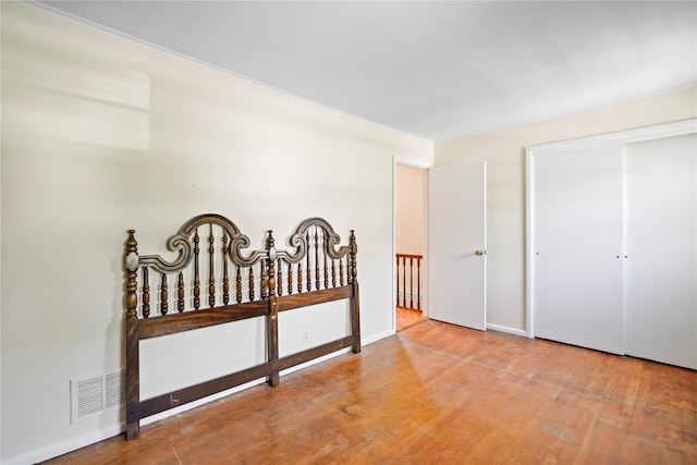 31 Westwood Ave, New Rochelle, NY 10801 - bedroom with wood finished floors, a closet, and baseboards