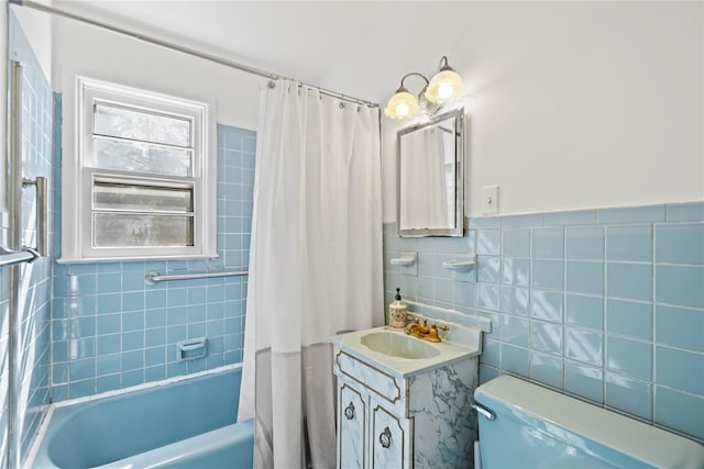 31 Westwood Ave, New Rochelle, NY 10801 - bathroom featuring shower / tub combo, tile walls, vanity, and toilet