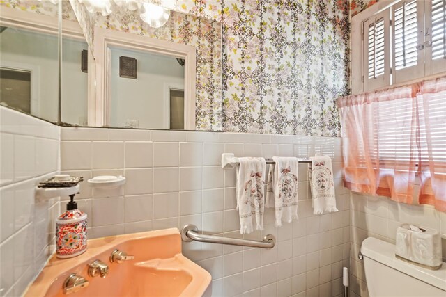 31 Westwood Ave, New Rochelle, NY 10801 - half bathroom with wallpapered walls, tile walls, and toilet