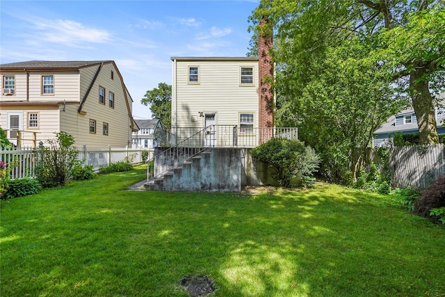 31 Westwood Ave, New Rochelle, NY 10801 - back of property featuring stairway, a chimney, and a wooden deck