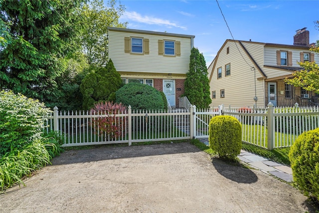 31 Westwood Ave, New Rochelle, NY 10801 - colonial house featuring a fenced front yard and brick siding