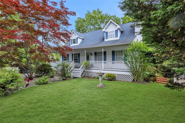 534 Puritan Dr, Shirley, NY 11967 - new england style home featuring roof with shingles, covered porch, and a front yard