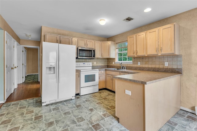 534 Puritan Dr, Shirley, NY 11967 - kitchen featuring white appliances, light brown cabinets, a sink, stone tile floors, and recessed lighting