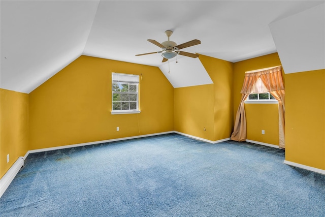534 Puritan Dr, Shirley, NY 11967 - bonus room featuring ceiling fan, carpet flooring, vaulted ceiling, baseboards, and a baseboard radiator