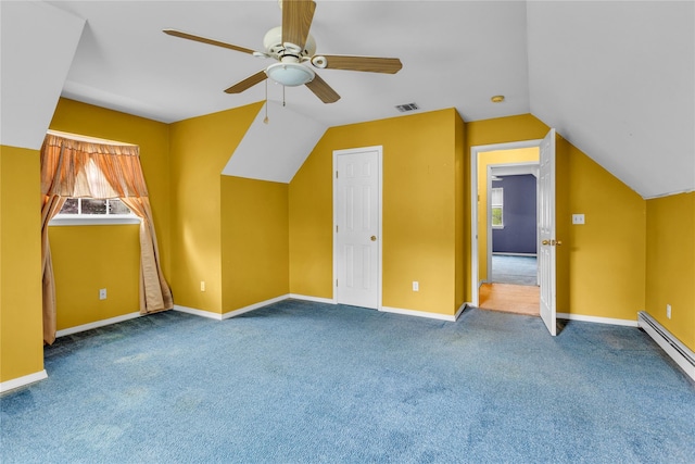 534 Puritan Dr, Shirley, NY 11967 - additional living space with baseboard heating, a ceiling fan, carpet flooring, lofted ceiling, and baseboards