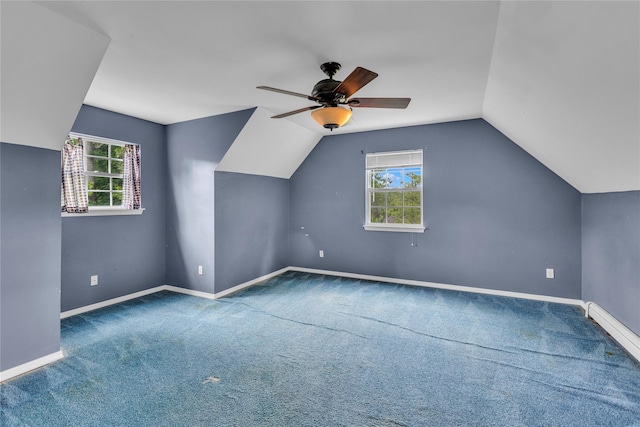 534 Puritan Dr, Shirley, NY 11967 - bonus room with healthy amount of natural light, vaulted ceiling, a ceiling fan, baseboards, and carpet floors