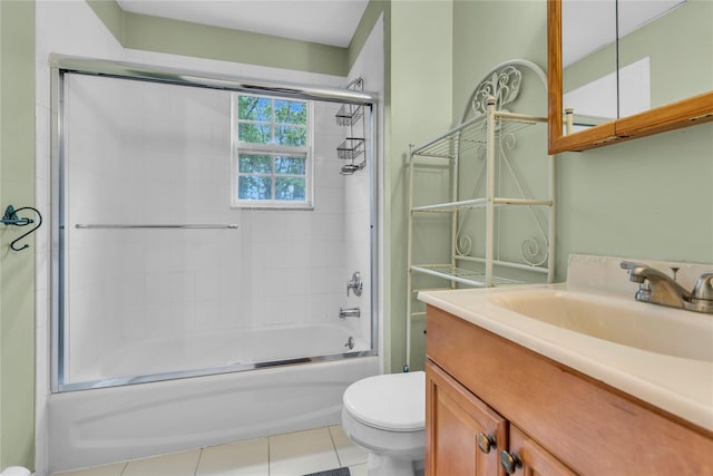 534 Puritan Dr, Shirley, NY 11967 - bathroom with toilet, combined bath / shower with glass door, vanity, and tile patterned flooring