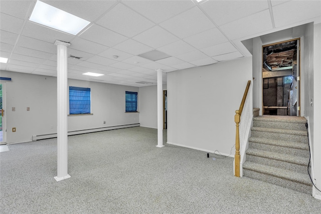 534 Puritan Dr, Shirley, NY 11967 - finished below grade area featuring a drop ceiling, stairs, a baseboard heating unit, carpet flooring, and baseboards