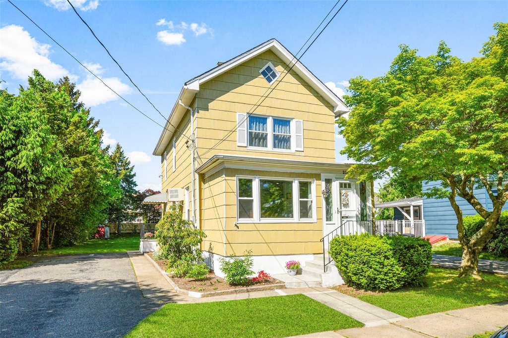 200 Jensen Ave, Mamaroneck, NY 10543 - view of front of house with a front lawn and asphalt driveway