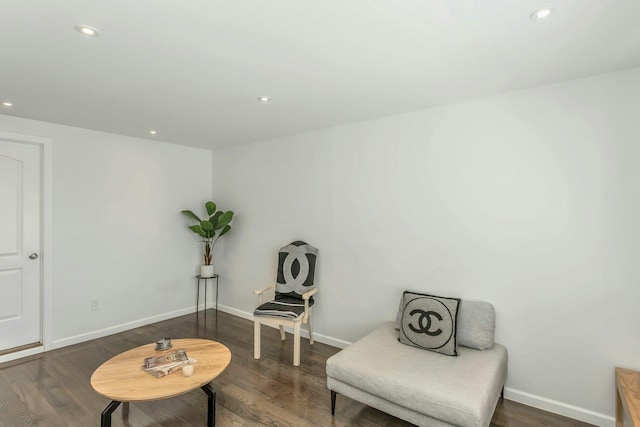 living area with recessed lighting, baseboards, and dark wood-style floors