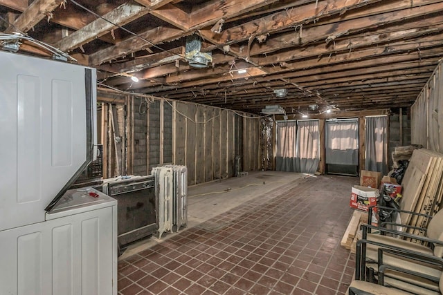 unfinished basement with radiator heating unit