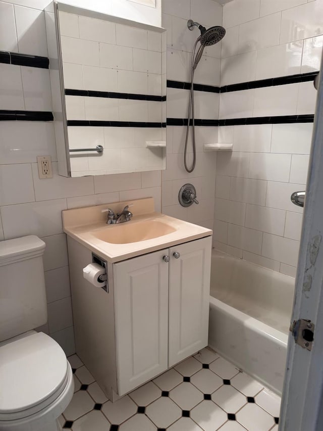 9825 64th Rd Unit 5F, Rego Park, NY 11374 - bathroom featuring tile walls, toilet, vanity, and shower / tub combination