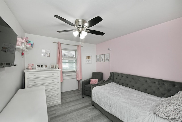 198 Millard Ave Unit 198, West Babylon, NY 11704 - bedroom with light wood-style flooring and a ceiling fan