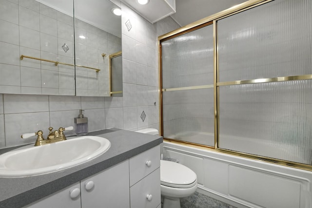 198 Millard Ave Unit 198, West Babylon, NY 11704 - full bath featuring tile walls, enclosed tub / shower combo, vanity, toilet, and decorative backsplash