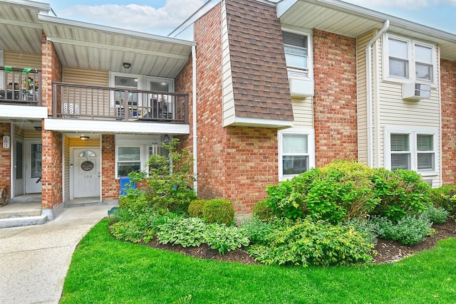 198 Millard Ave Unit 198, West Babylon, NY 11704 - view of front of property with a balcony and brick siding