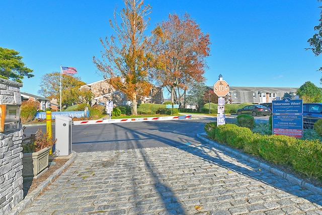 198 Millard Ave Unit 198, West Babylon, NY 11704 - view of road featuring a residential view, traffic signs, and curbs
