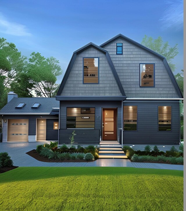 dutch colonial with a front yard, a gambrel roof, a garage, and driveway