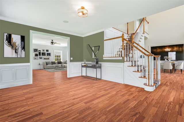 7 Viola Ct, Wappingers Falls, NY 12590 - foyer with stairway, wood finished floors, ornamental molding, wainscoting, and a ceiling fan