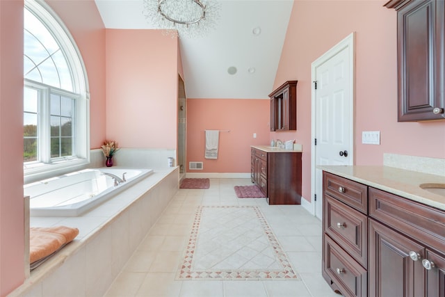 7 Viola Ct, Wappingers Falls, NY 12590 - bathroom featuring tile patterned floors, two vanities, vaulted ceiling, a bath, and a shower stall