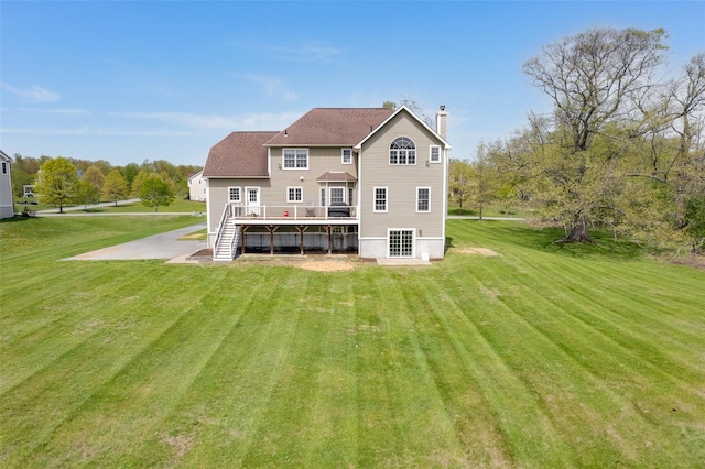 7 Viola Ct, Wappingers Falls, NY 12590 - back of property featuring a wooden deck, a chimney, stairway, and a lawn