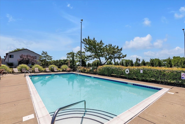 community pool featuring fence