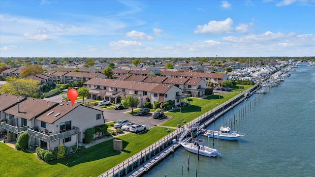 aerial view of residential area with a large body of water