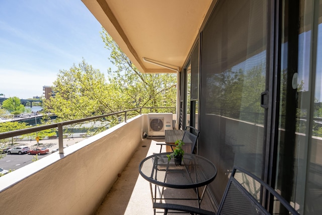 balcony featuring ac unit