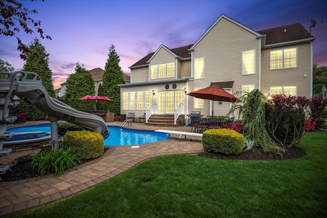 7 Moreland Ct, Mount Sinai, NY 11766 - back of house featuring entry steps, a patio, a yard, an outdoor pool, and a jacuzzi