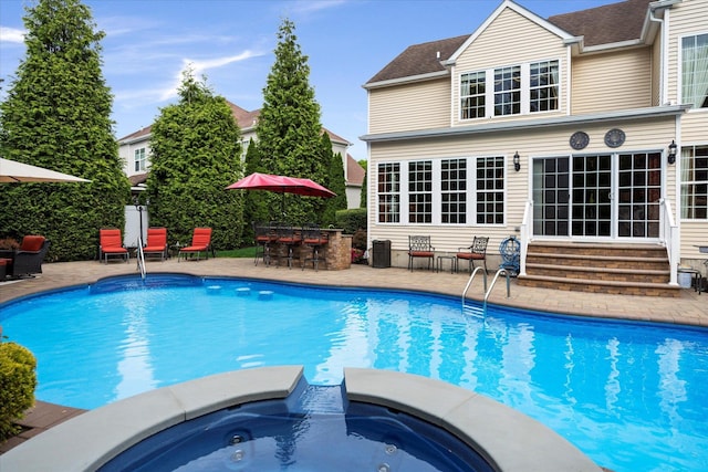 7 Moreland Ct, Mount Sinai, NY 11766 - view of pool featuring entry steps, a patio area, and a pool with connected hot tub