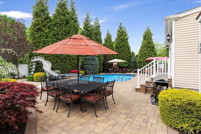 7 Moreland Ct, Mount Sinai, NY 11766 - view of patio / terrace with outdoor dining space and view of scattered trees