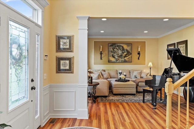7 Moreland Ct, Mount Sinai, NY 11766 - foyer featuring light wood-style floors, ornamental molding, wainscoting, recessed lighting, and a decorative wall