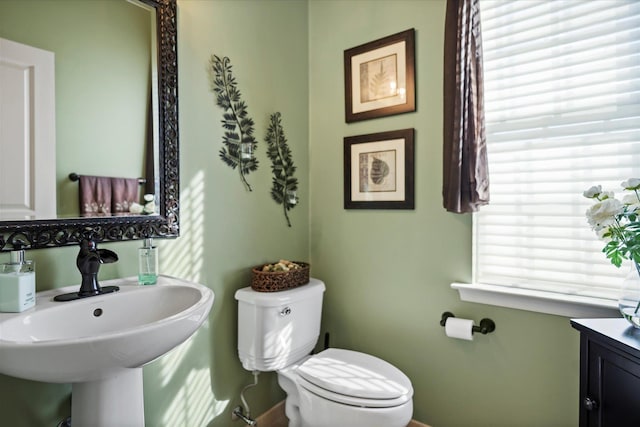 7 Moreland Ct, Mount Sinai, NY 11766 - bathroom featuring toilet, a sink, and baseboards