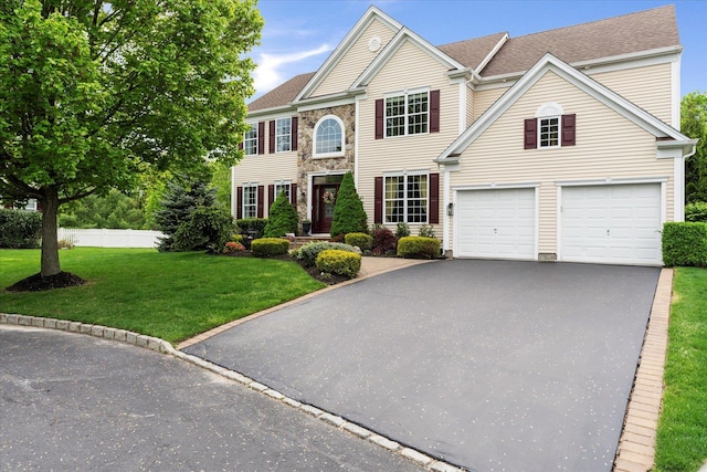 7 Moreland Ct, Mount Sinai, NY 11766 - colonial home with driveway, an attached garage, and a shingled roof