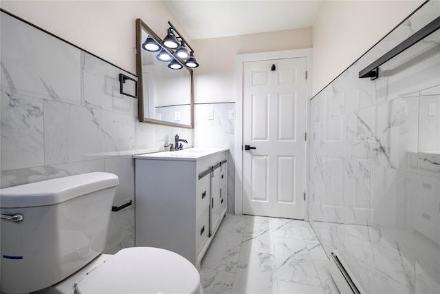 bathroom with toilet, tile walls, vanity, marble finish floor, and a baseboard radiator