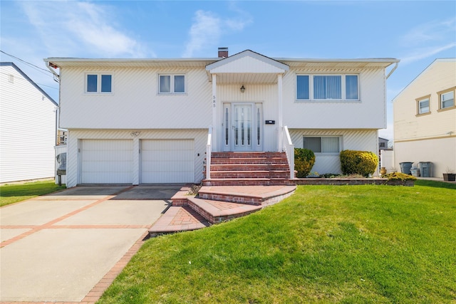 585 Nassau Ave, Freeport, NY 11520 - raised ranch with a front yard, a garage, and driveway