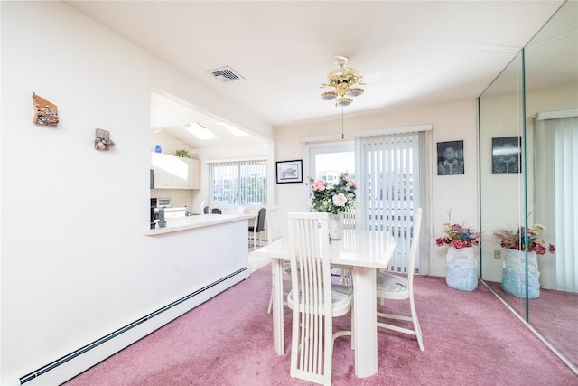 585 Nassau Ave, Freeport, NY 11520 - dining area featuring baseboard heating, light colored carpet, and ceiling fan