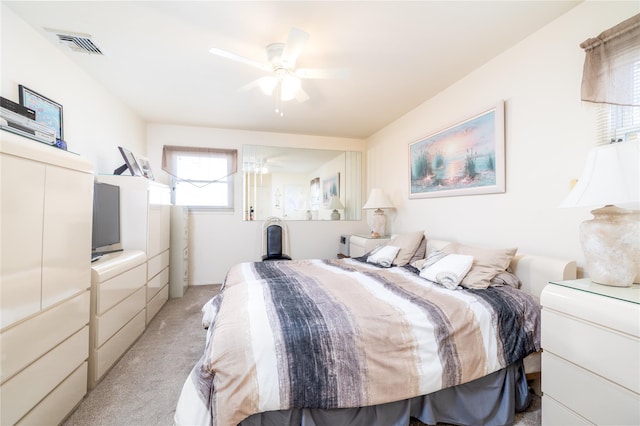585 Nassau Ave, Freeport, NY 11520 - bedroom with light colored carpet and a ceiling fan
