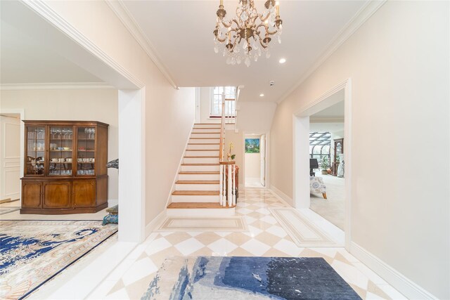 entrance foyer featuring stairs, a chandelier, ornamental molding, light flooring, and baseboards
