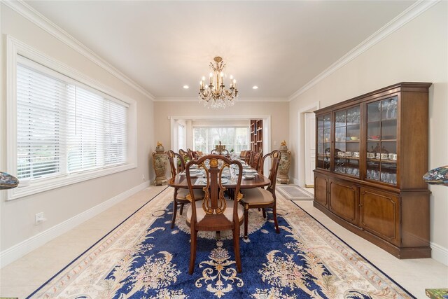 dining space with a chandelier, crown molding, baseboards, and recessed lighting