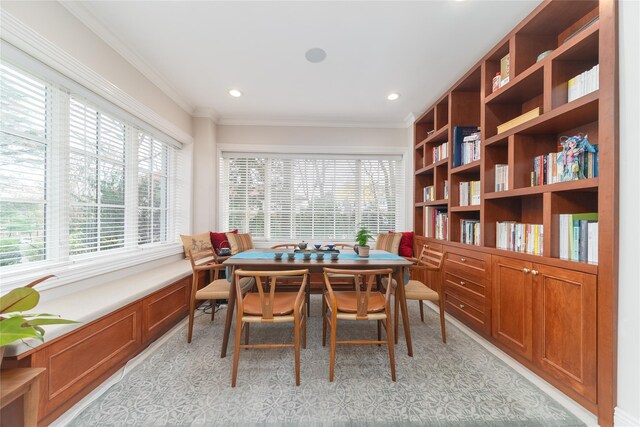 dining room featuring healthy amount of natural light, ornamental molding, and recessed lighting