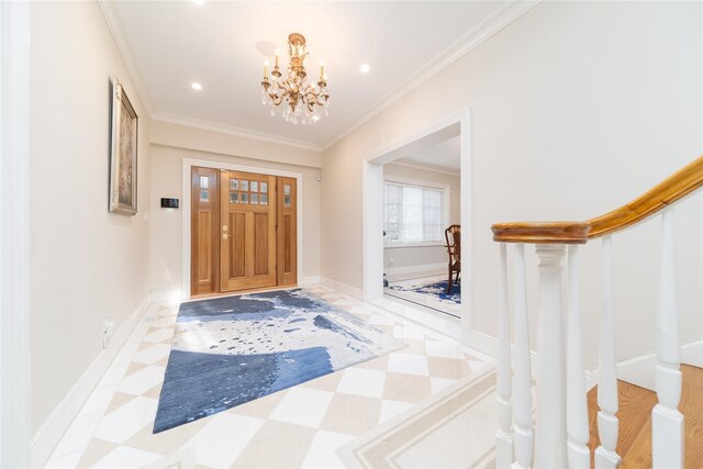 foyer featuring a chandelier, ornamental molding, recessed lighting, stairs, and baseboards