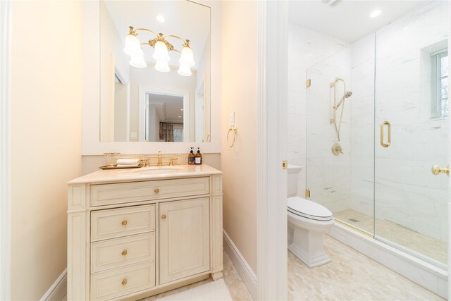 full bath featuring toilet, a marble finish shower, vanity, and a chandelier