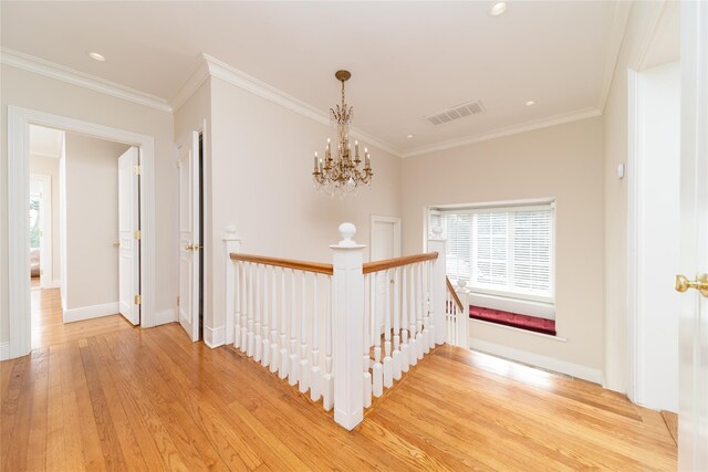 stairs with wood finished floors, baseboards, crown molding, recessed lighting, and a chandelier