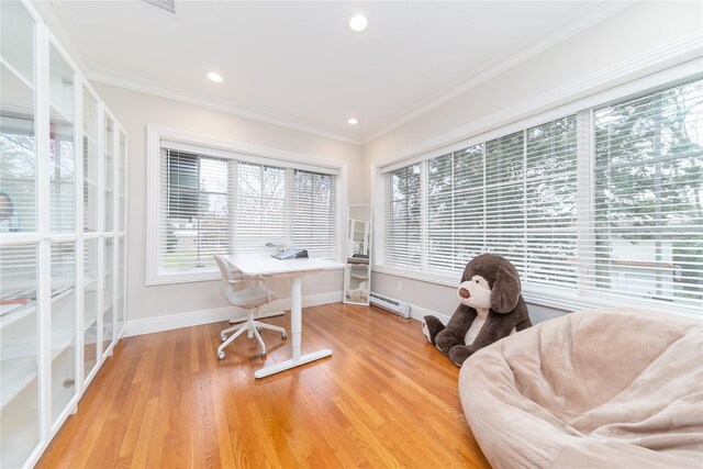 office space with ornamental molding, baseboards, light wood-style floors, recessed lighting, and a baseboard radiator