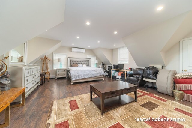 bedroom featuring a wall mounted air conditioner, wood finished floors, a baseboard radiator, recessed lighting, and lofted ceiling