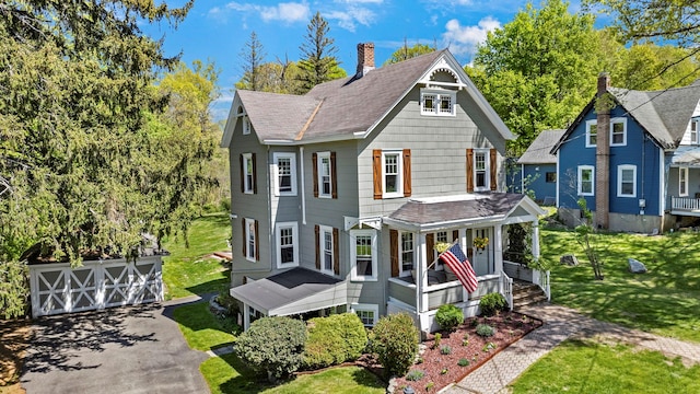 80 Hill St, Walden, NY 12586 - victorian house featuring an outbuilding, a porch, roof with shingles, and a front lawn